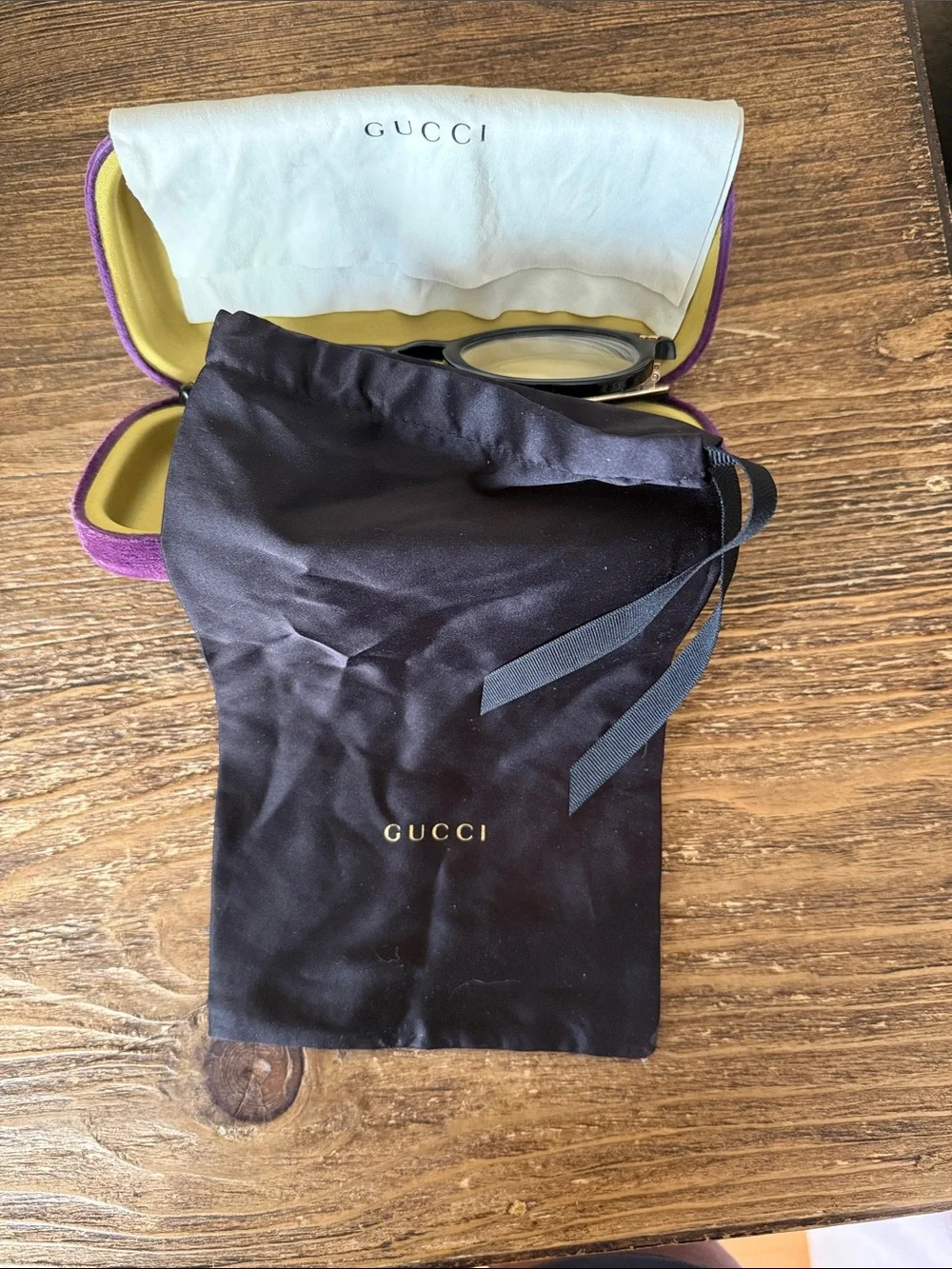 Gucci Black Round Optical Glasses with purple case, dust bag, and cleaning cloth